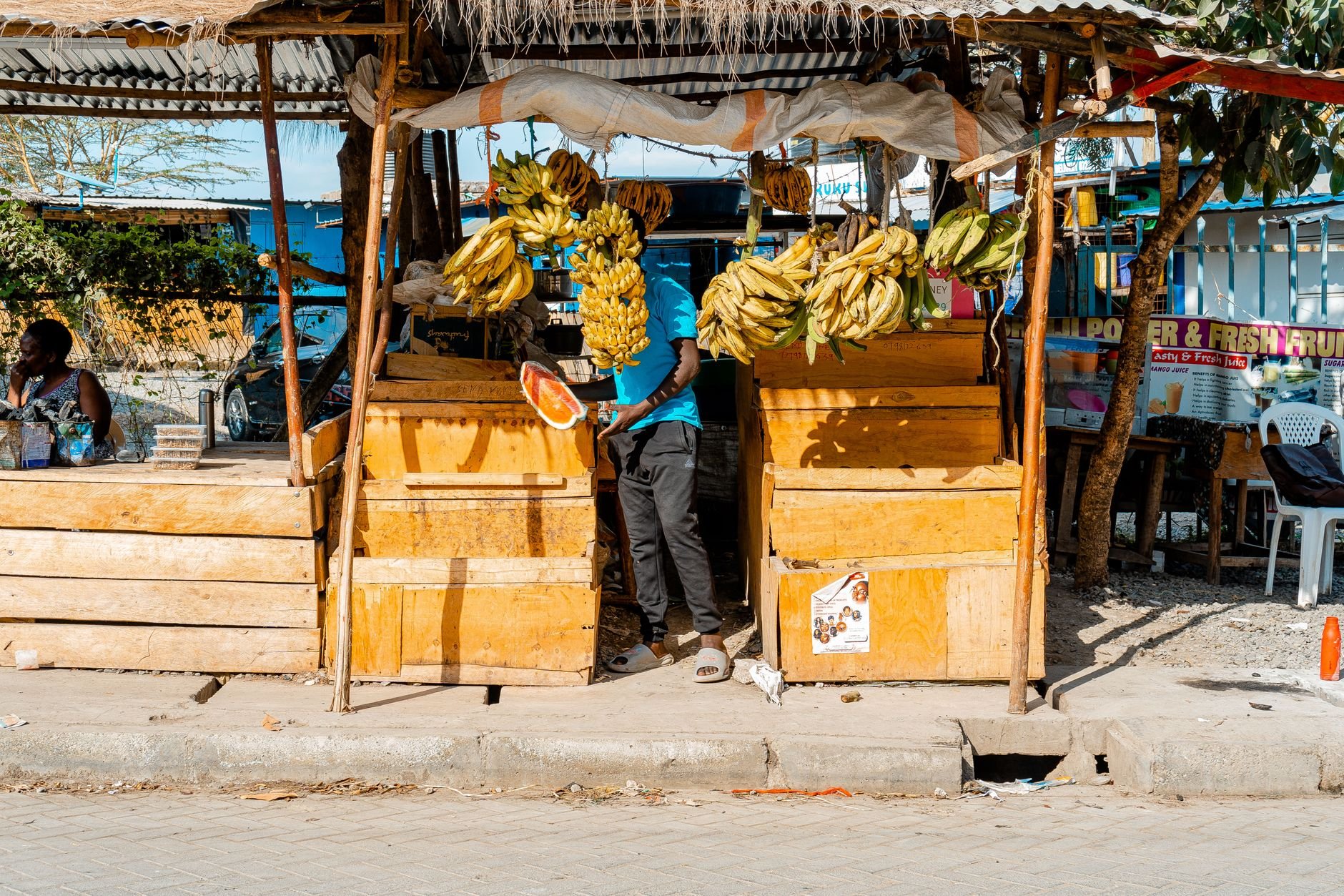 A vibrant Nairobi street market showcasing vendors selling bananas and local produce.